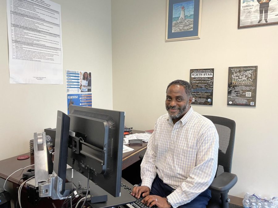 Hard Working Warrior: North Atlanta Principal Curtis Douglas works diligently during limited alone time in his office, in between meetings and surprise student drop-ins.