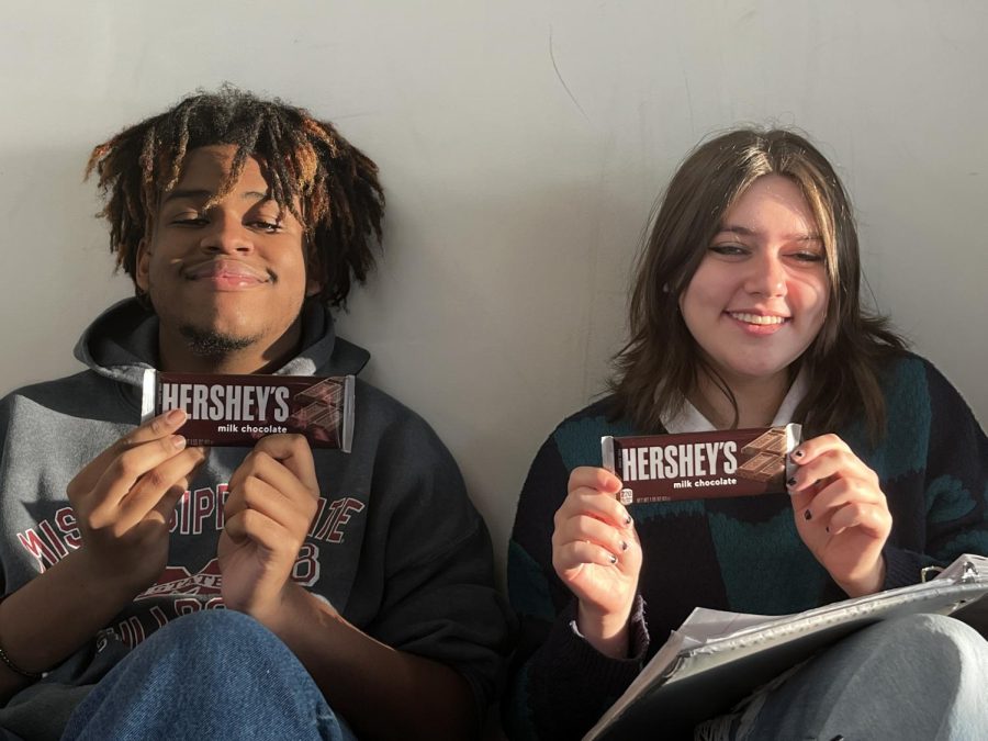 Tempting Treats: Juniors Aidan Smith and Janie Heller posing with one of the most praised candy bars.