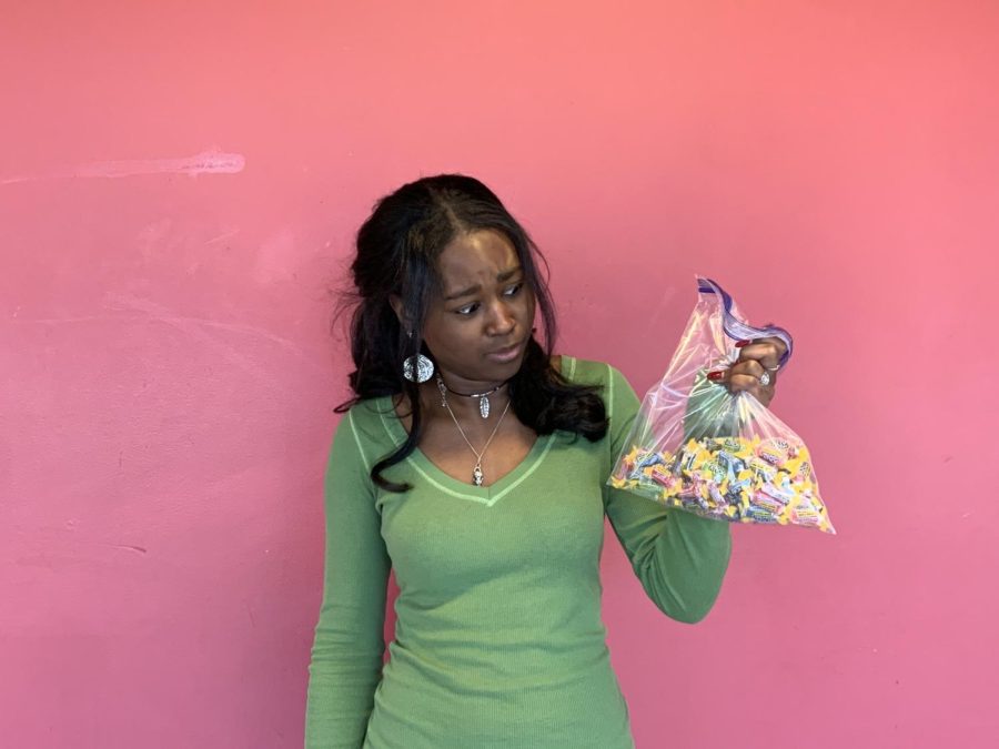 A Trick in the Treat: Junior Ayana Ragin judging her candy before consumption.
