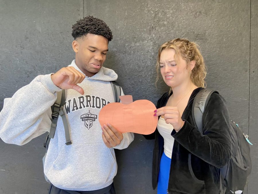 Two devious dubs, Juniors Xaden Benson and Taylor Ryan, look in disgust at the pumpkin in there mist. One question remains true: why don’t they go for the gourd?