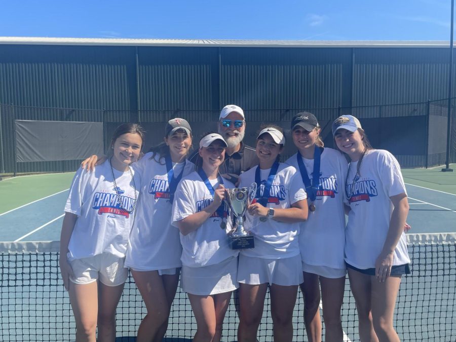 Hard Work Pays Off: Coach Mike Hutchings and last year’s seniors smile after winning State Championship. 