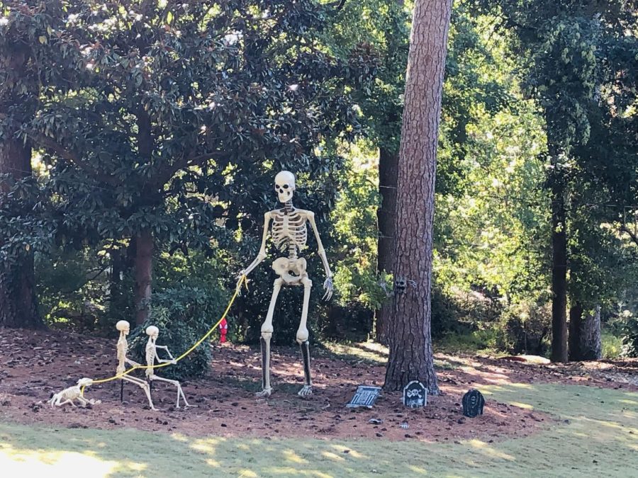 Daring Decor: A friendly skeleton takes his dog for a walk in the yard of an Atlanta home.