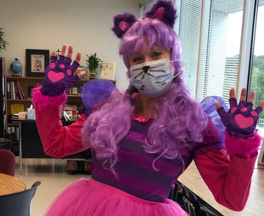 Dr. Hasty proudly smiles as she shows off her colorful Cheshire cat costume.