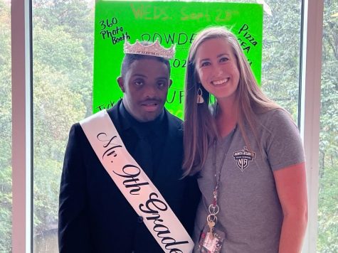 All Smiles: Mrs. Rhodes with one of her students, Gabriel Warrior, at his crowning ceremony after winning Mr. Ninth Grade.
