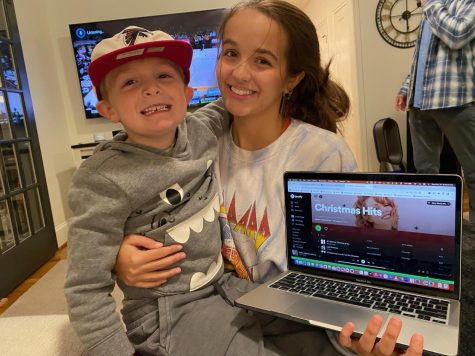 Junior Taylor Mosley shares her festive holiday tunes with little brother, Miles.