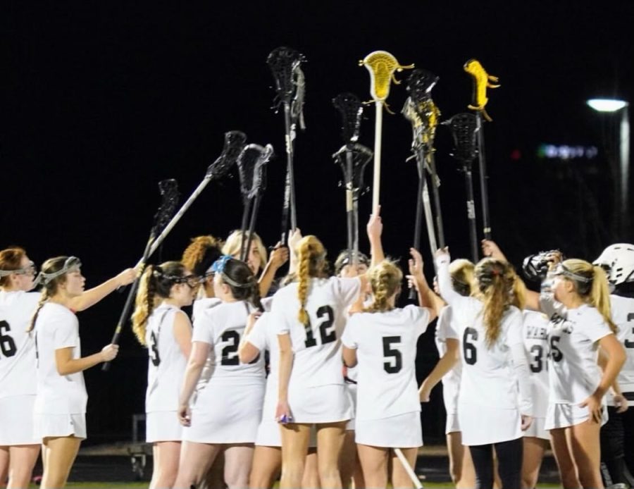 Dubs+on+Top%3A+Girls+Lacrosse+teams+raise+their+sticks+after+a+big+win.