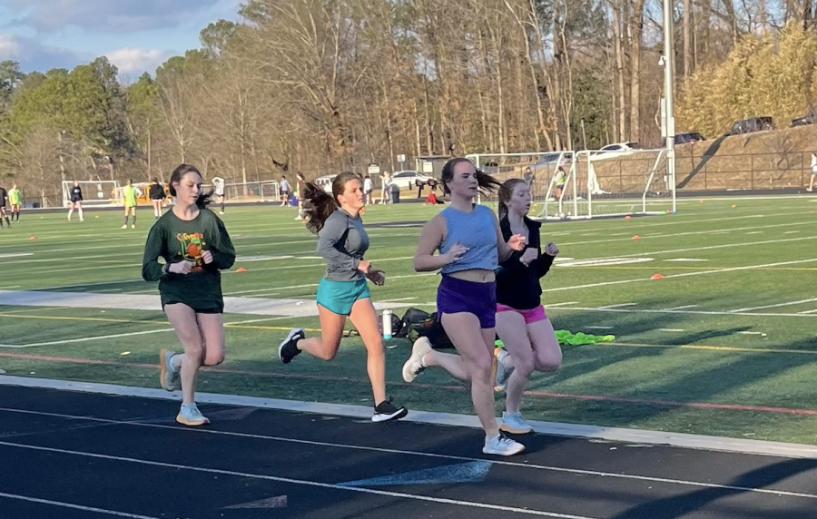 Junior+Stacy+Carter%2C+Sophomore+Izzie+Mock%2C+and+Senior+Ana+are+warming+up+with+a+jog+before+Track+%26+Field+tryouts+commence.