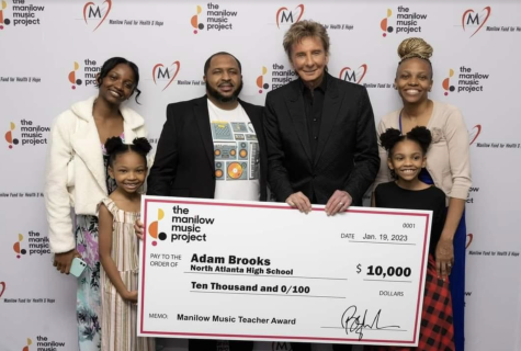 Above and Beyond: Music technology teacher Adam Brooks recieved the Manilow Music Project award at Barry Manilows concert on January 19, 2023, celebrating his exceptional achievements in musical education. 
