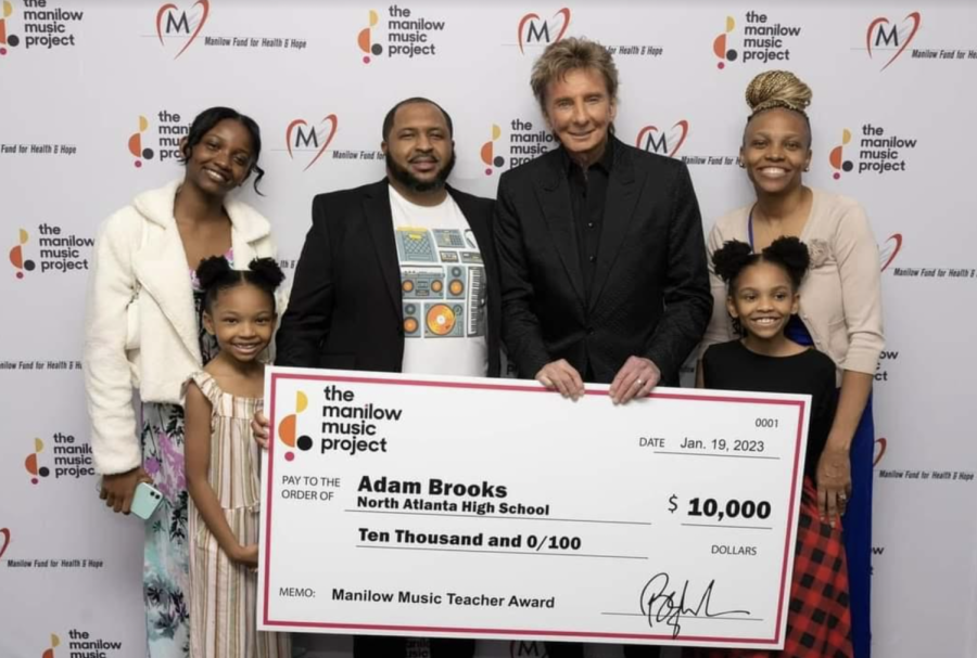 Above+and+Beyond%3A+Music+technology+teacher+Adam+Brooks+recieved+the+Manilow+Music+Project+award+at+Barry+Manilows+concert+on+January+19%2C+2023%2C+celebrating+his+exceptional+achievements+in+musical+education.+%0A