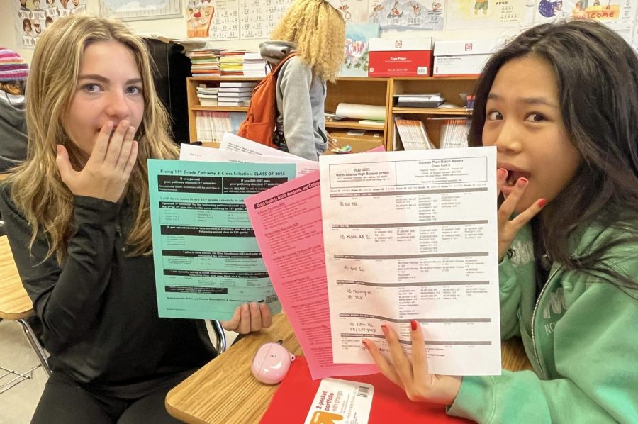 Square One: Sophomores Charlotte Akins and Karli Chan look over their brand-new, busy schedules for junior year. Upperclassmen support makes for an A+ schedule.
