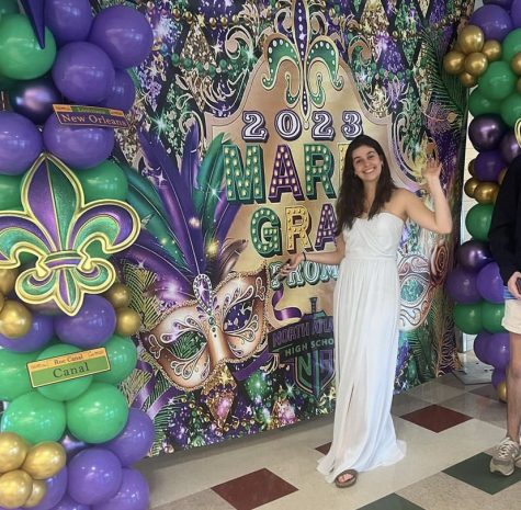 Mardi Gras Galore: SGA Member Maggie Koontz excitedly reveals the 2023 prom theme to the Dubs during lunch.