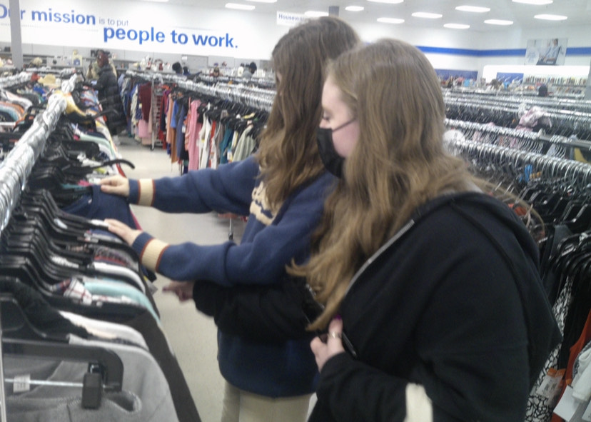 Juniors Siena Schettino and Libby Gray Hall scour the racks of a local Goodwill to discover the next, best get-up to rock at school.
