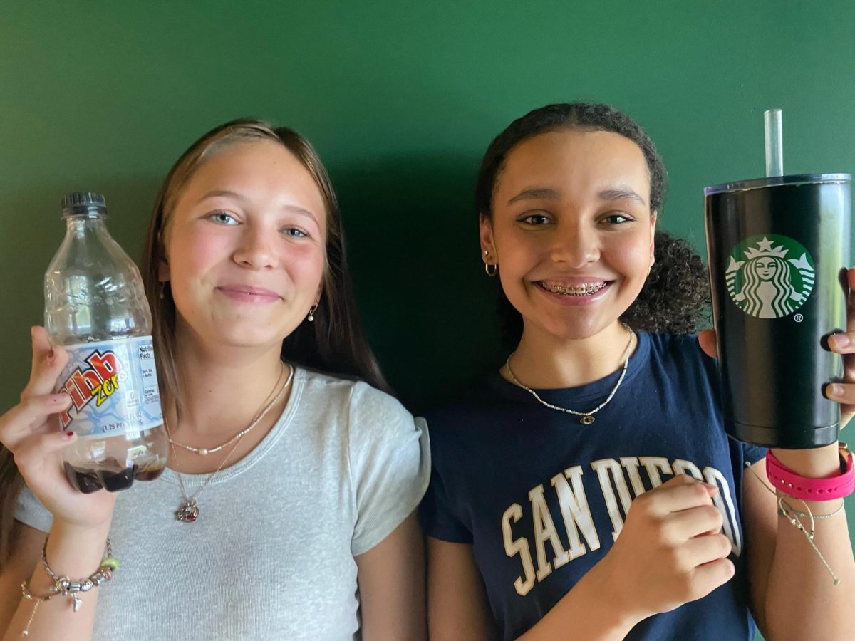  Dawn, Dubs and Drinks: London Sario and Sophia Campbell holding their drink of the day 