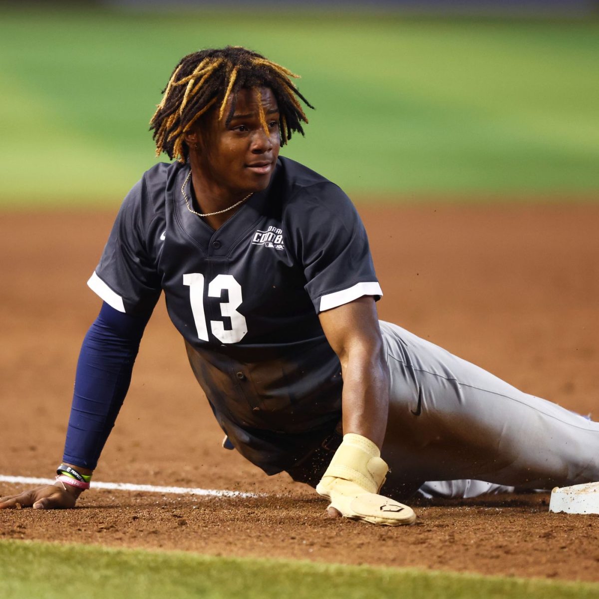 Atlanta Braves draft pick and former North Atlanta student Isaiah Drake slides into third base after hitting a triple