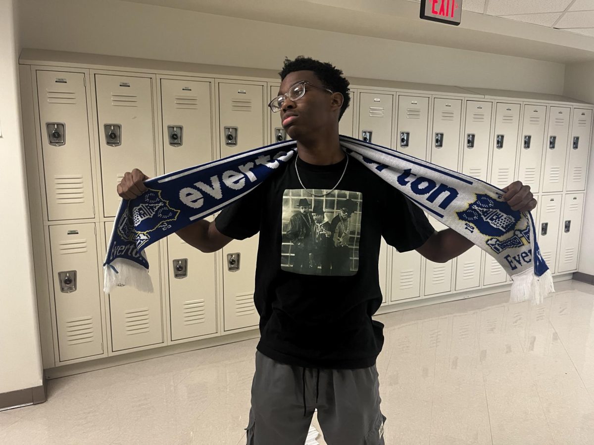 Junior Jackson Fraiser shows off his gear and shows his support for his favorite club.
