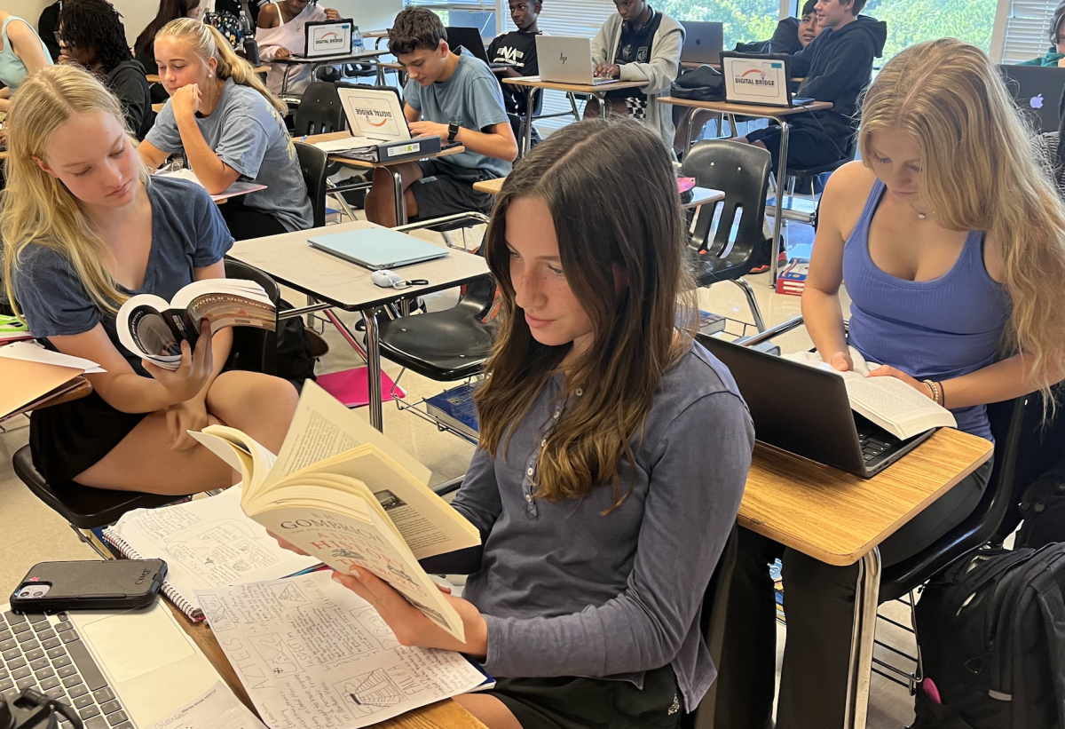 Reading+Warriors%3A+Sophomores+Campbell+Mann%2C+Sarah+Kate+Gleason%2C+and+Brailyn+Boardman+have+chosen+to+read+books+instead+of+looking+at+their+phones.