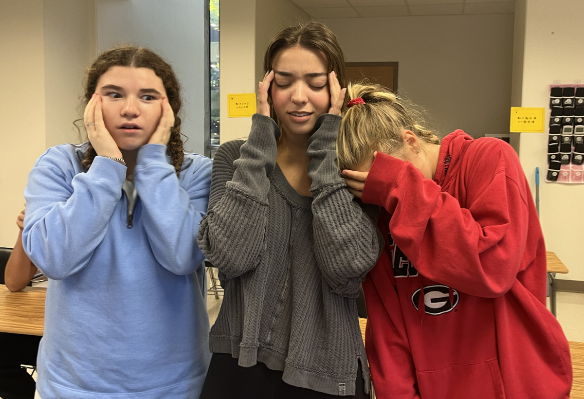 Drowning in the Deadlines: Seniors Herriot Parsons, Halle Pray and Anna Samuelson feeling the senior stress. 
