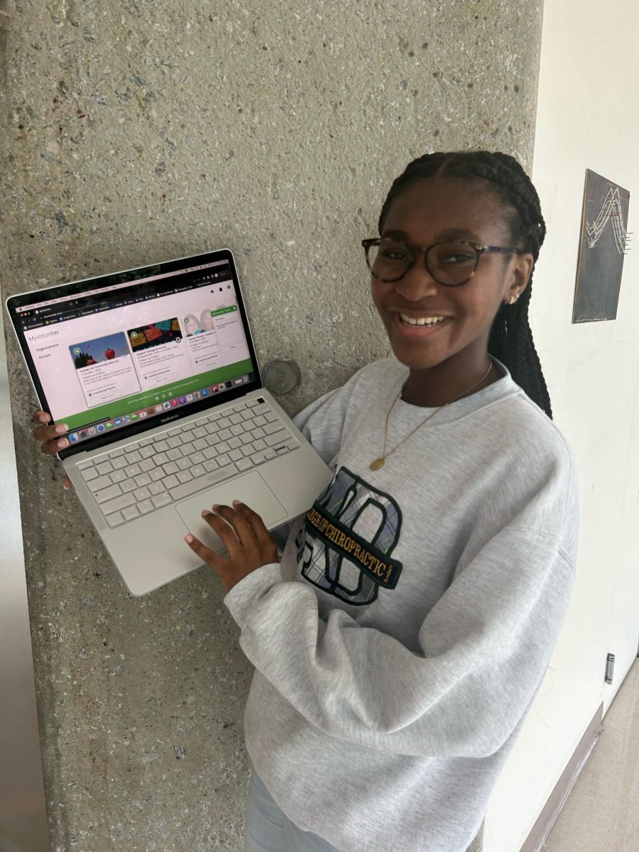 Sophomore, Bailey Lynch, uses MyVoluntier app to check up on her service hours.