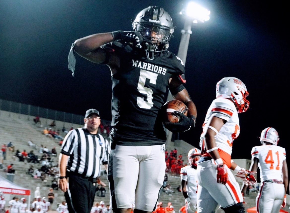 Warrior senior running back Demeitrus “Meedee” Barnes stands in the end zone at Henderson Stadium in Midtown after touchdown in a big Dubs win against New Manchester on Sept. 1. 

