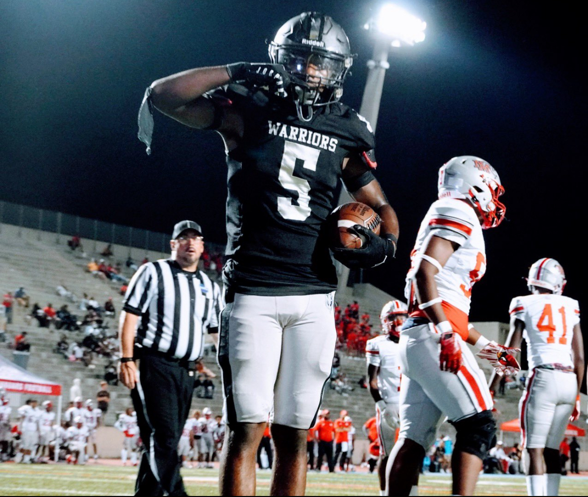 Warrior senior running back Demeitrus “Meedee” Barnes stands in the end zone at Henderson Stadium in Midtown after touchdown in a big Dubs win against New Manchester on Sept. 1. 

