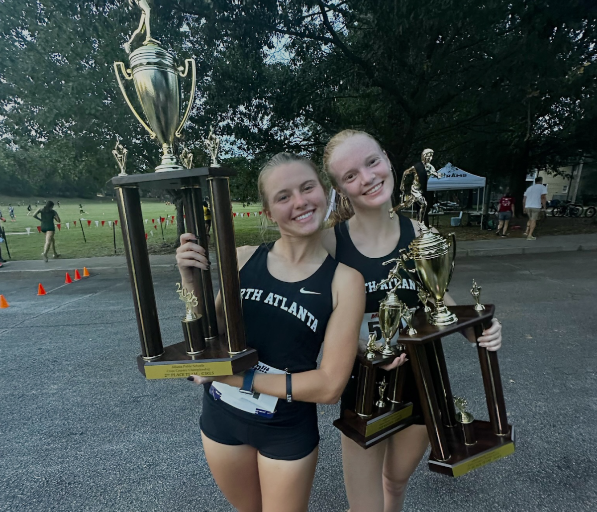 Blazing the Trail to Greatness: Seniors Catherine Townsend and Ansley McCaffrey  raise their trophies after a glorious day at the APS Championship!