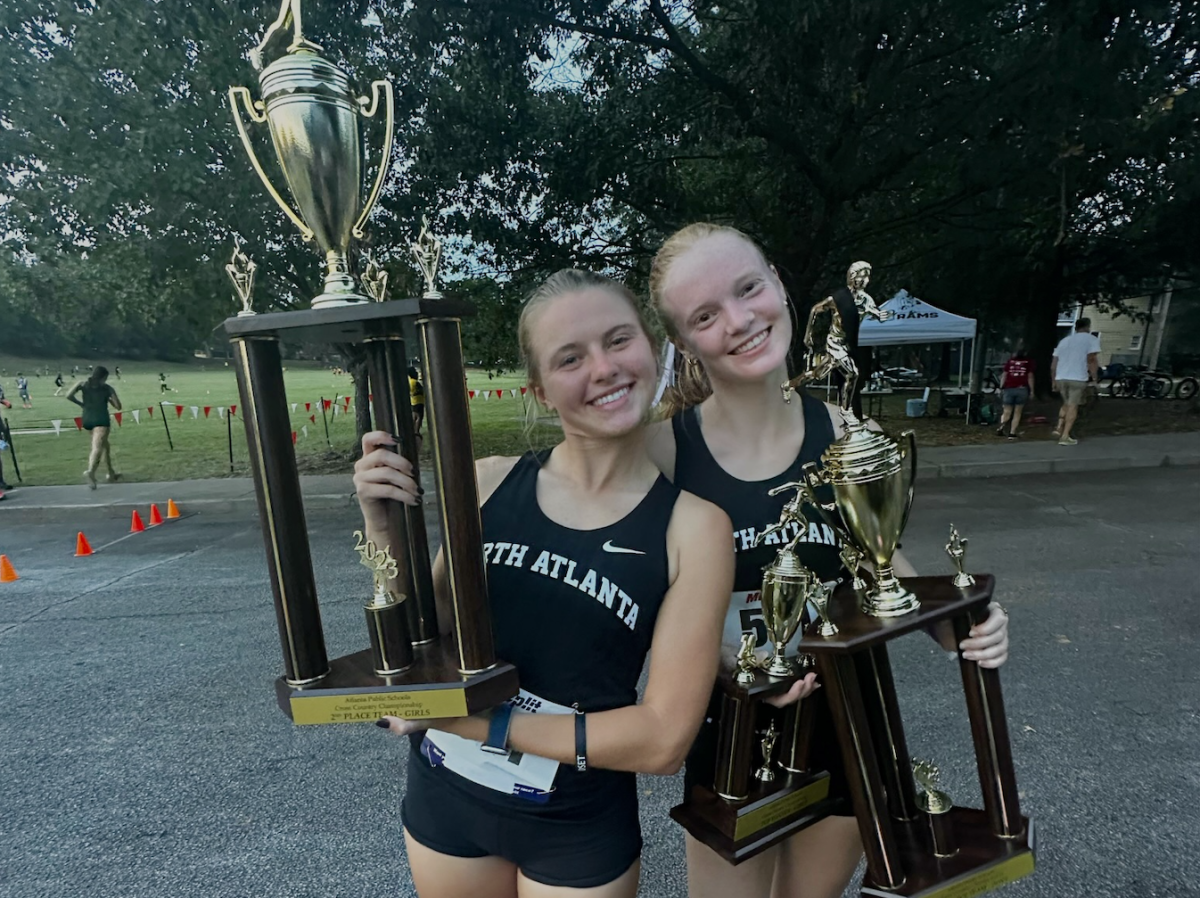 Blazing+the+Trail+to+Greatness%3A+Seniors+Catherine+Townsend+and+Ansley+McCaffrey++raise+their+trophies+after+a+glorious+day+at+the+APS+Championship%21