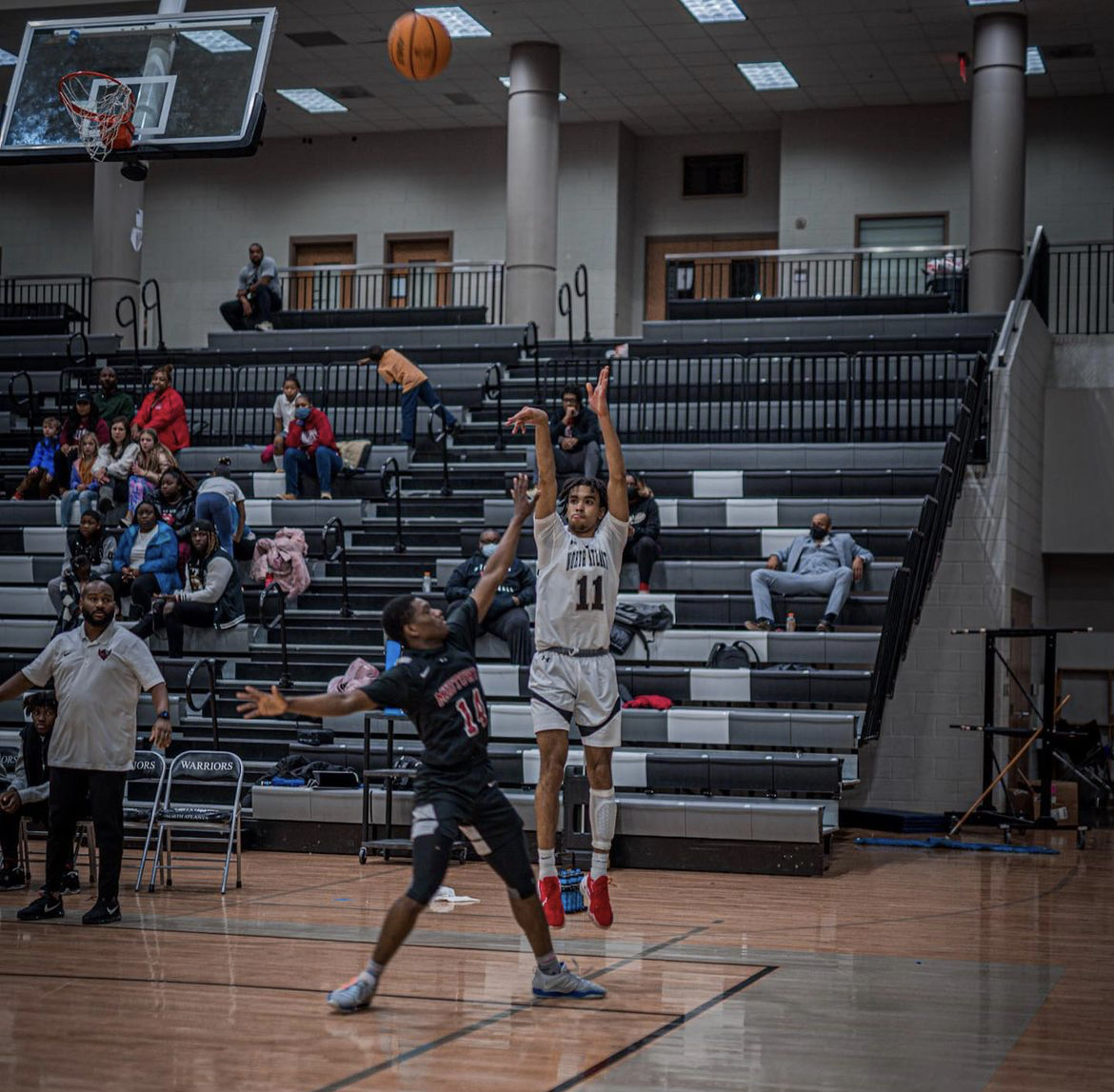 Its+raining+threes%3A+Josh+Griffith+%2824%29+rises+up+to+hit+a+three+pointer+over+an+opposing+player