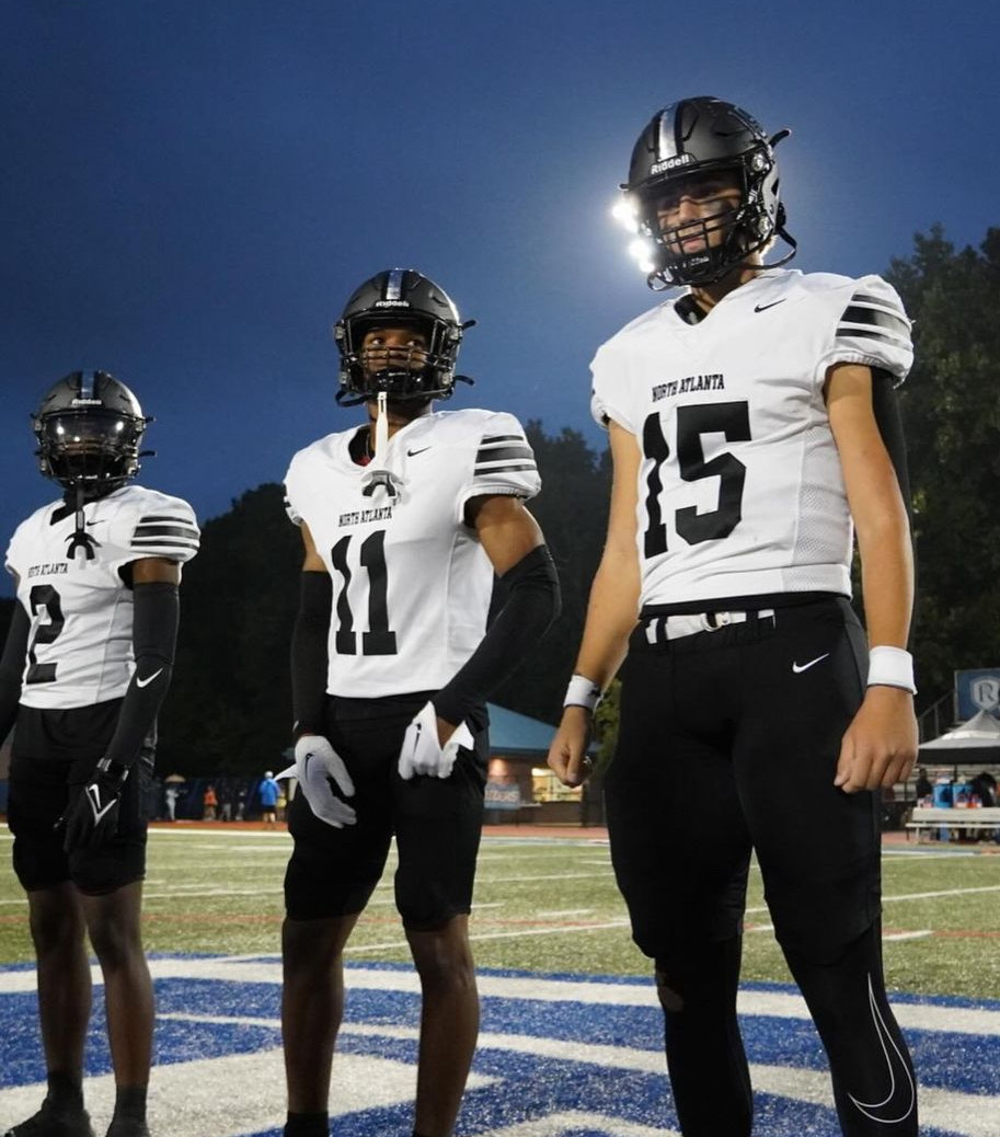 Back again: Ireyfootball, Xaddy, and Dmalc line up for the coin flip during Friday night lights