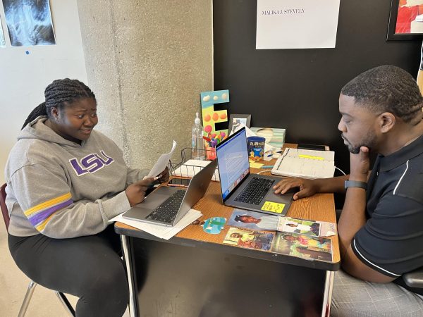 Like Teacher Like Student: History teacher Elliot Reid and senior Kaleigh Fleming both focus on their coursework, one as a graduate student and the other as a high schooler at North Atlanta.