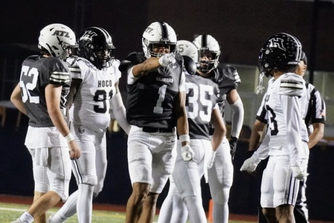 Dub Domination: Junior wide receiver Grant Thompson celebrates after a tremendous first down reception.