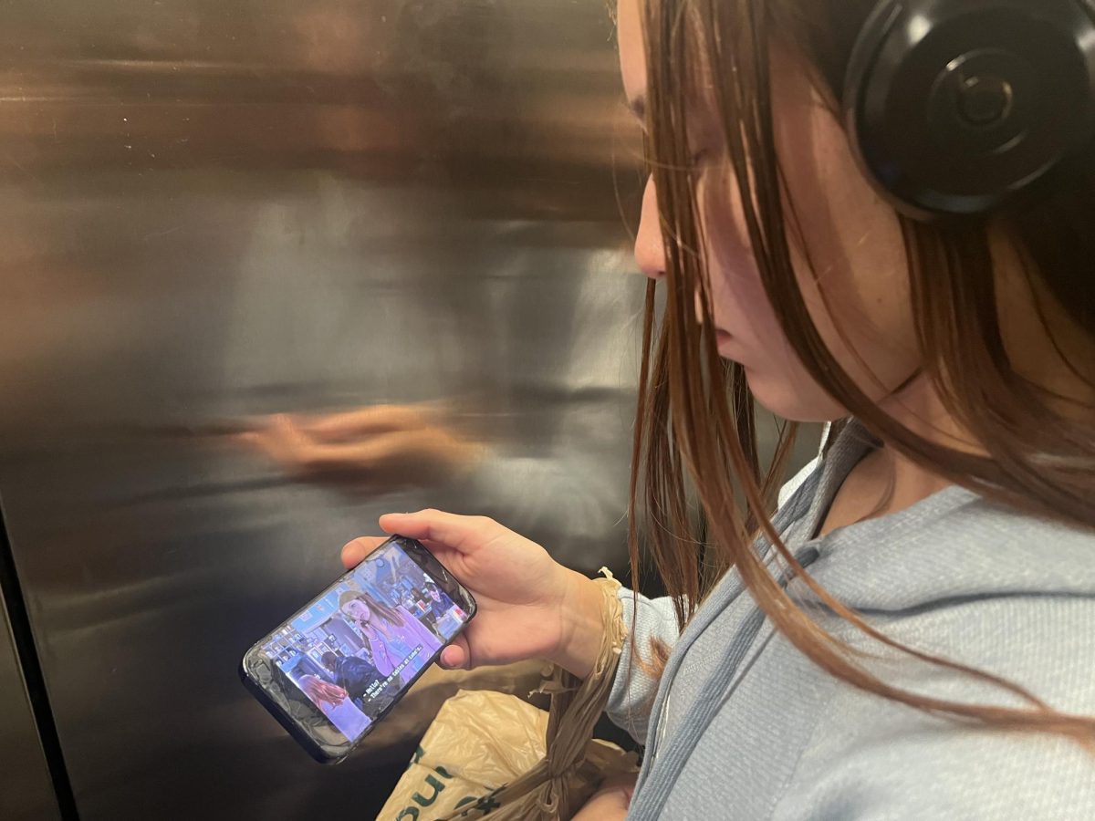 Portable Entertainment: Senior Mia Simpson watches her favorite show, Gilmore Girls.