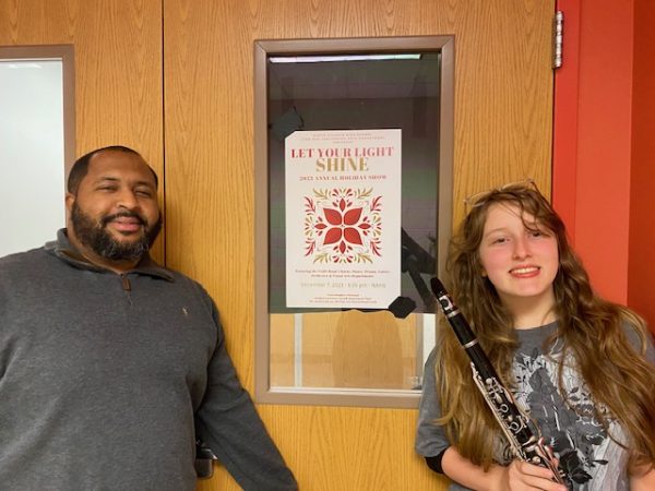 Adam Brooks and Serafina Cohen promoting the flyer for “Let Your Light Shine” showcase
