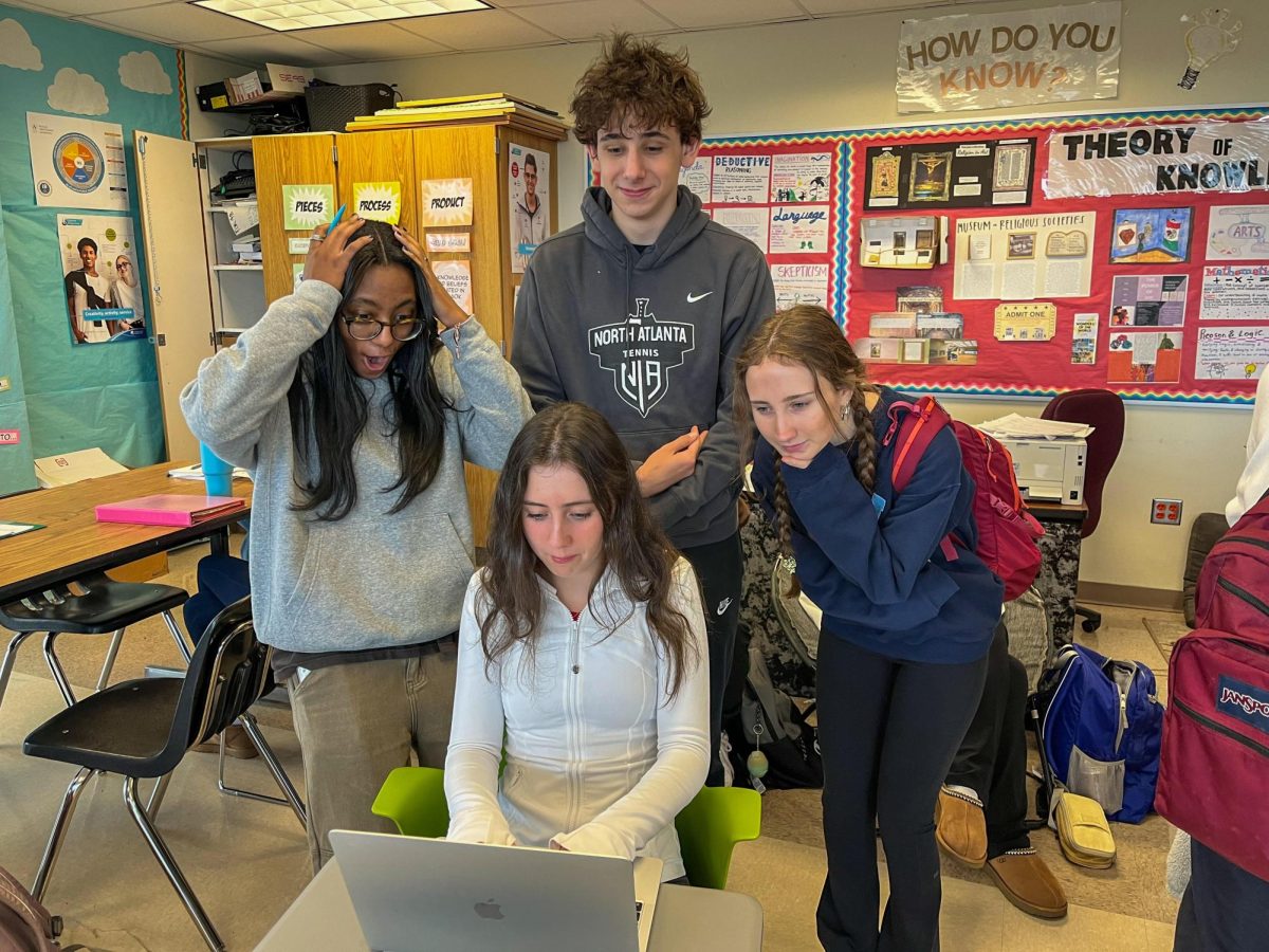 Cracking the Code: Students work together in class to solve one of the various puzzles of the day.