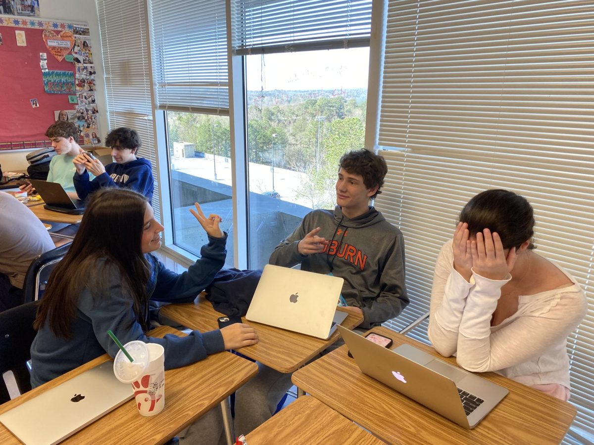 Pick a Number: Juniors Meyrav Malino, Jack Scultz, and Katherine Moss engage in a round of Wavelength.