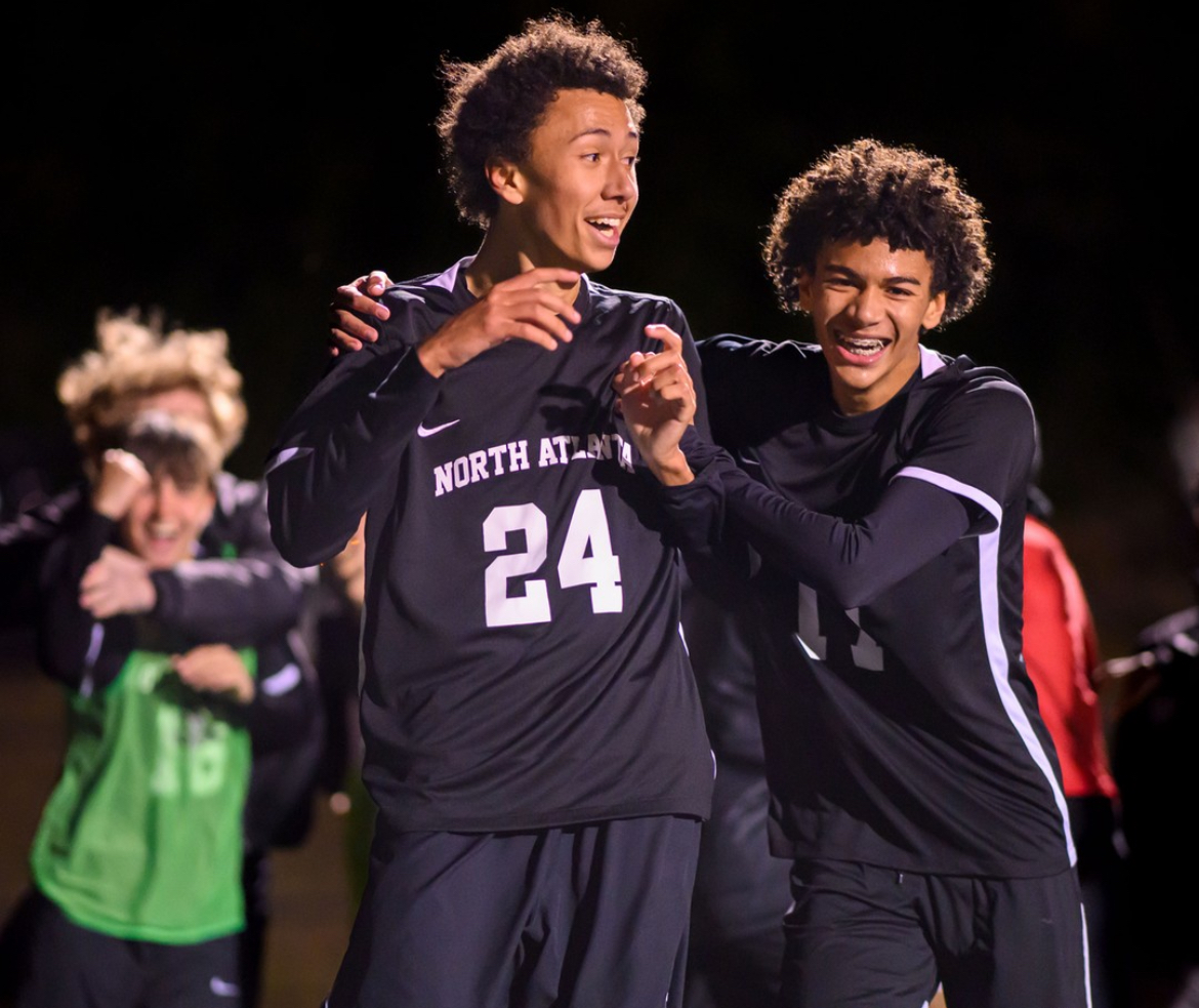 Star+striker+Lathan+Johnson+and+his+brother+Hudson+celebrate+together.