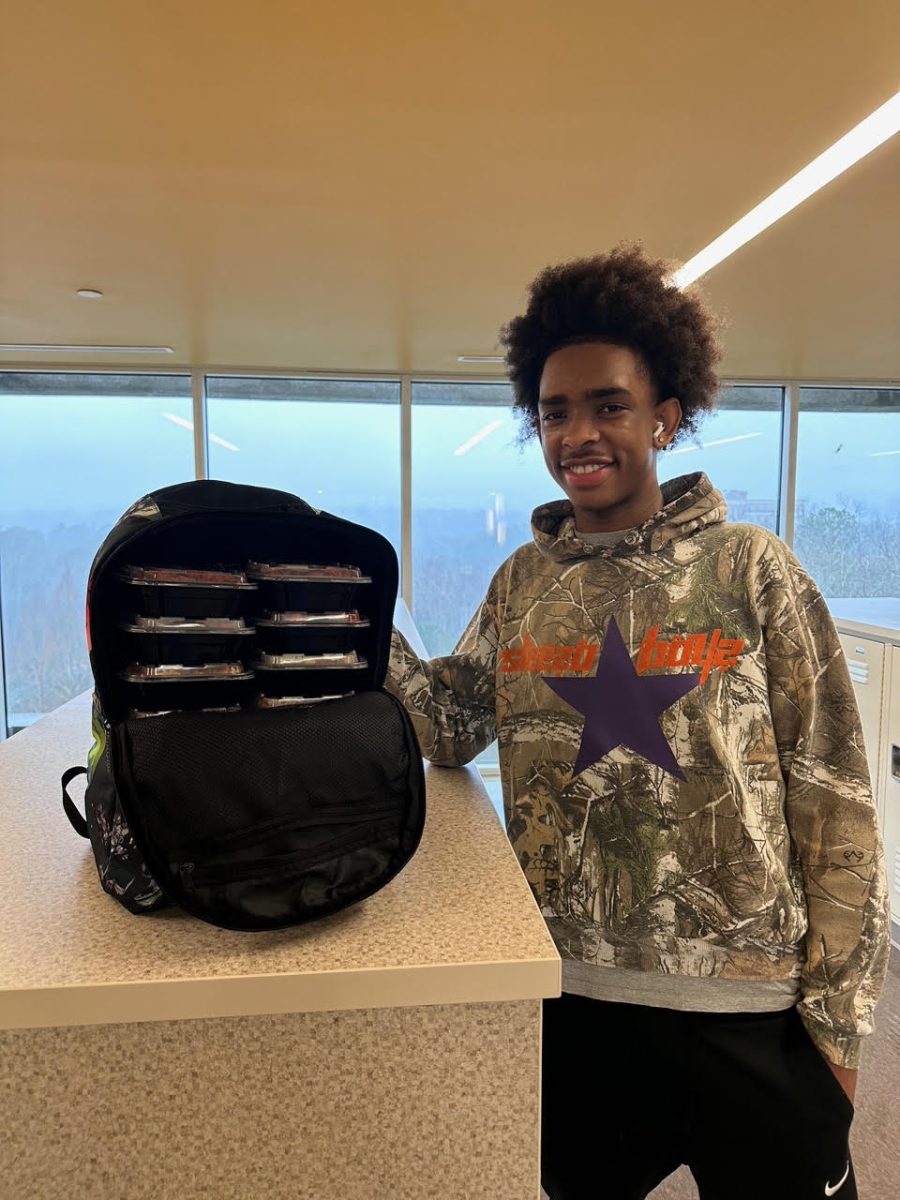 Senior Amir Carter poses with his latest food creation for North Atlanta.