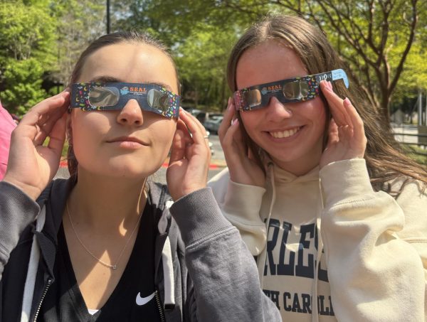Senior Lauren Davis and Junior Mary Woodward don their protective glasses to enjoy Monday’s Solar Eclipse.