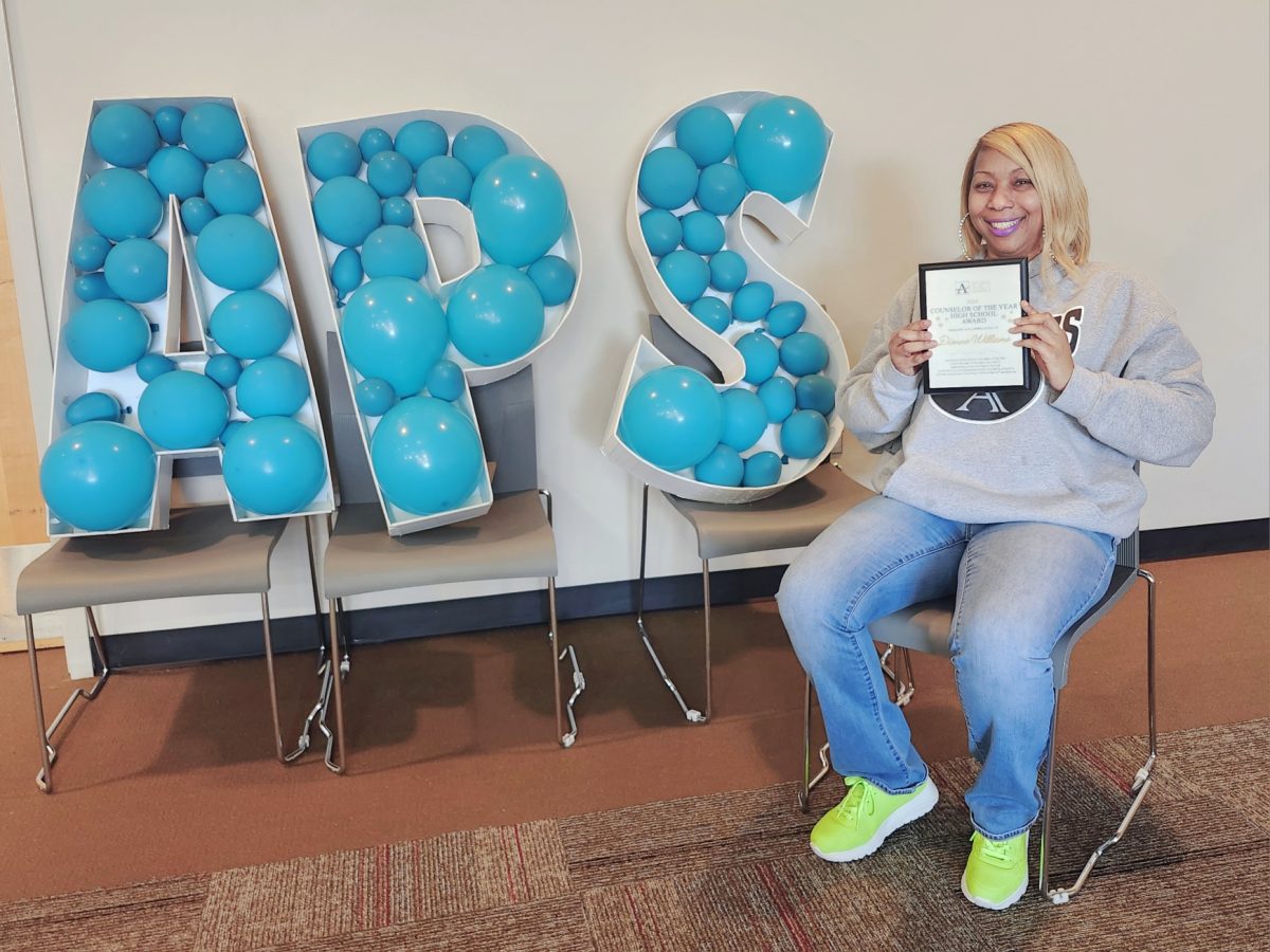 Counseling Excellence: Dionne Williams Poses With Her Counselor of the Year Award