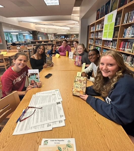 2023-24 Tome Society Club members meeting on an early Thursday ready to discuss books!