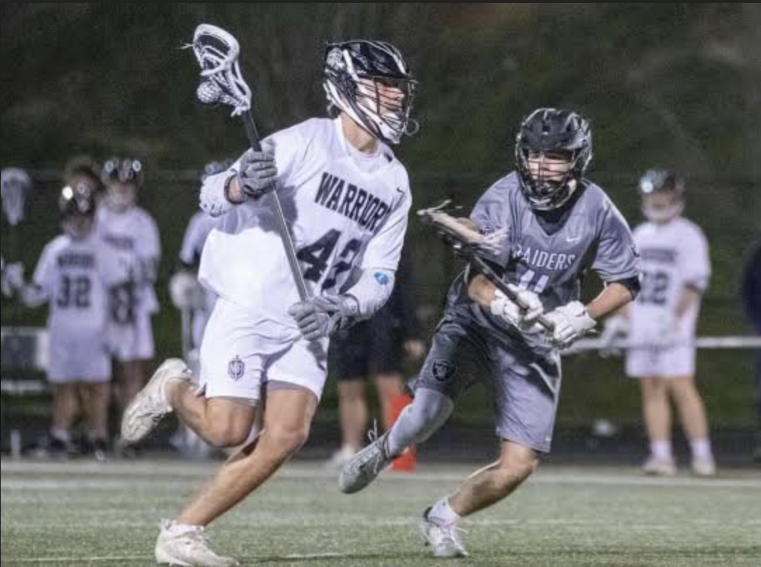 Brooks Newberry runs past a defender on the way to take a shot.
