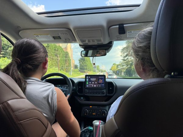 Summer on the Move: Laurel Touwsma and Sydney Pechter jam out in the car