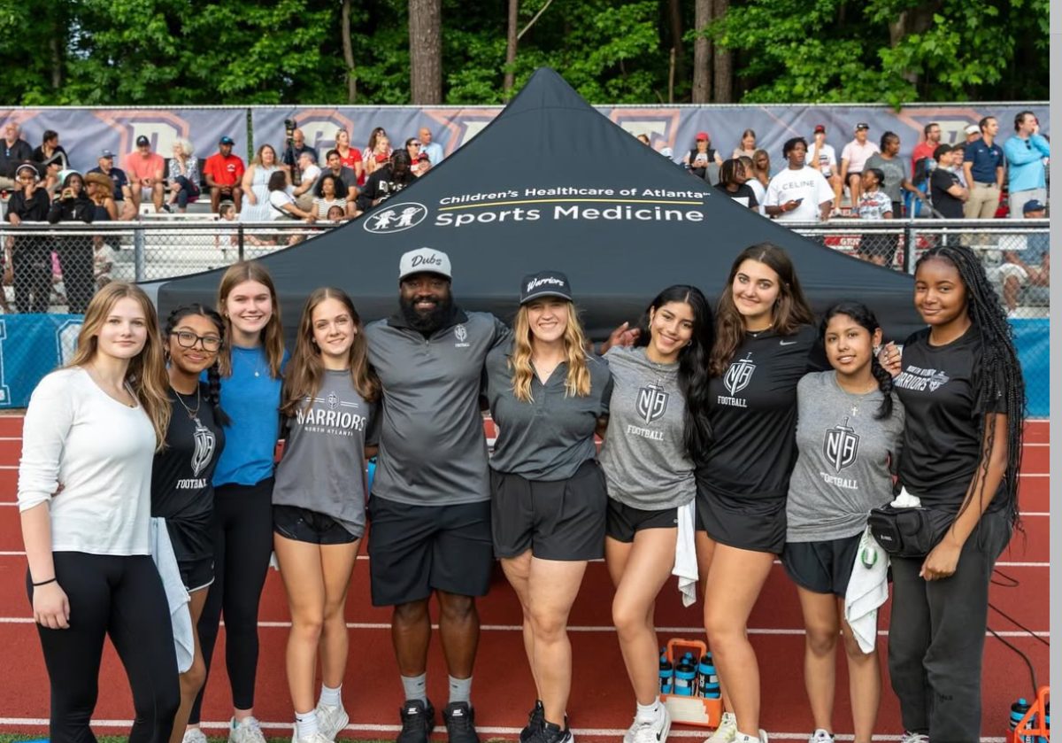 The team behind it all—our sports medicine group standing tall at the football scrimmage.
