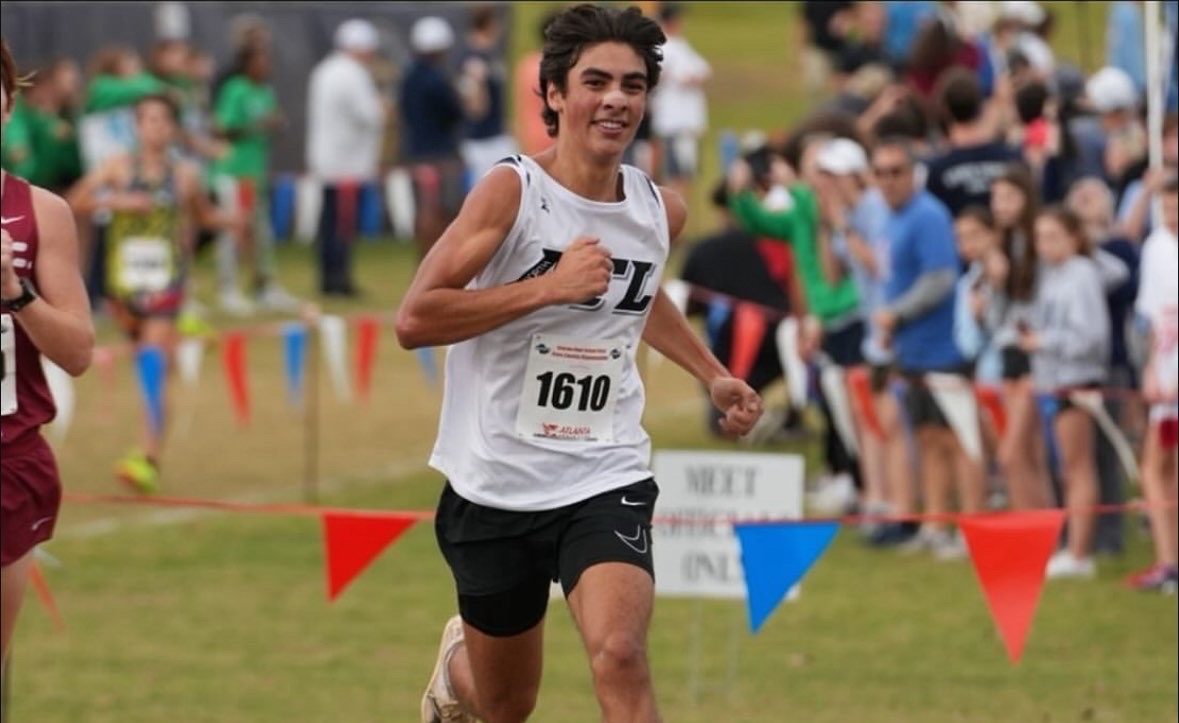 Arjun Mitra striding for the finish line at the GHSA state meet last year.