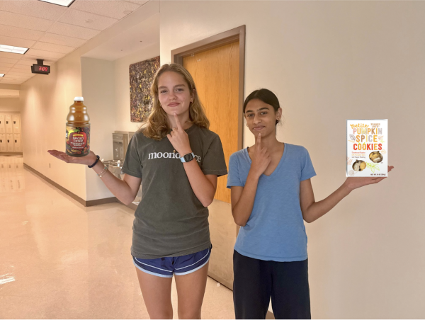 Anjali Gowda (11) and Caroline Whitney (11) debating on what their favorite fall snack is. 