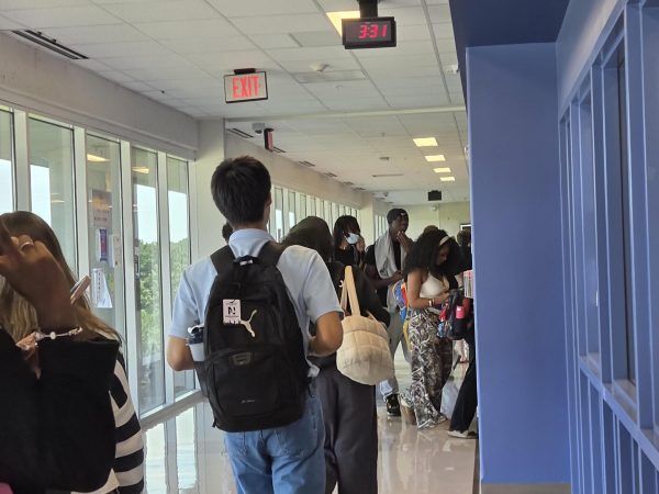 Crowded Calamity: The increased student population enters the stairwell after being packed in countless classes.