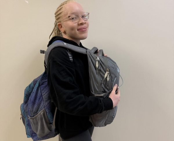 Strength Training on the Go: Marcella Mokam carrying both her bags instead of using her locker.