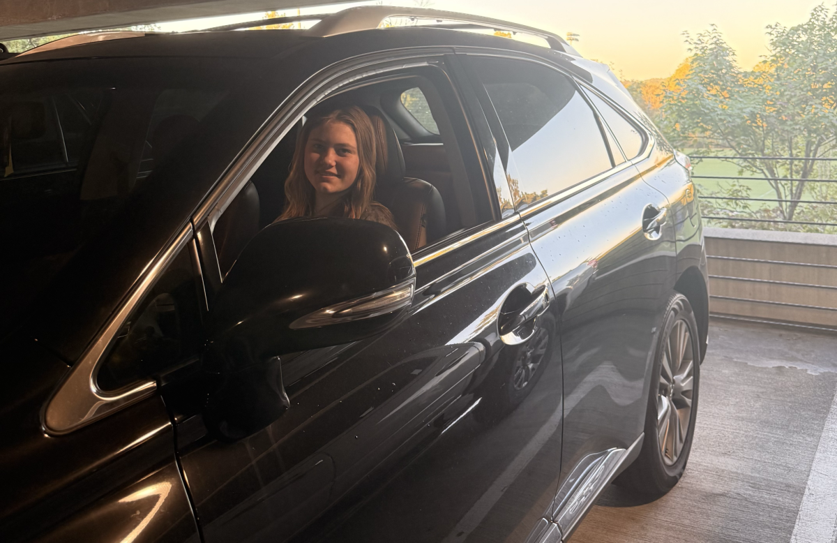 Walker McCaleb sitting in her car relaxing before she has to walk into class.
