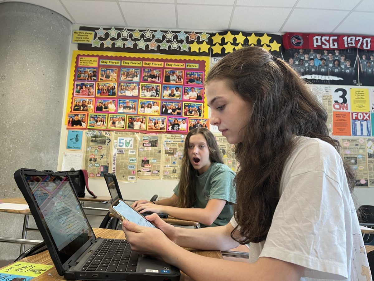 Students mimic how cheating commonly occurs, especially with technology, in NAHS classrooms.