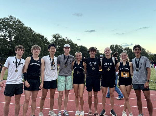 Final Run: Senior cross country runners together after their final APS championship race