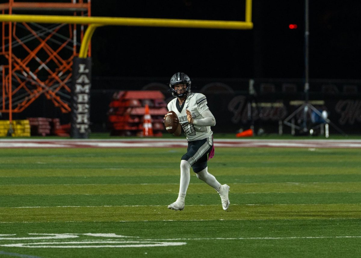 Friday night lights shining bright on quarterback Weston Goodman leading the Dubs with focus and confidence.